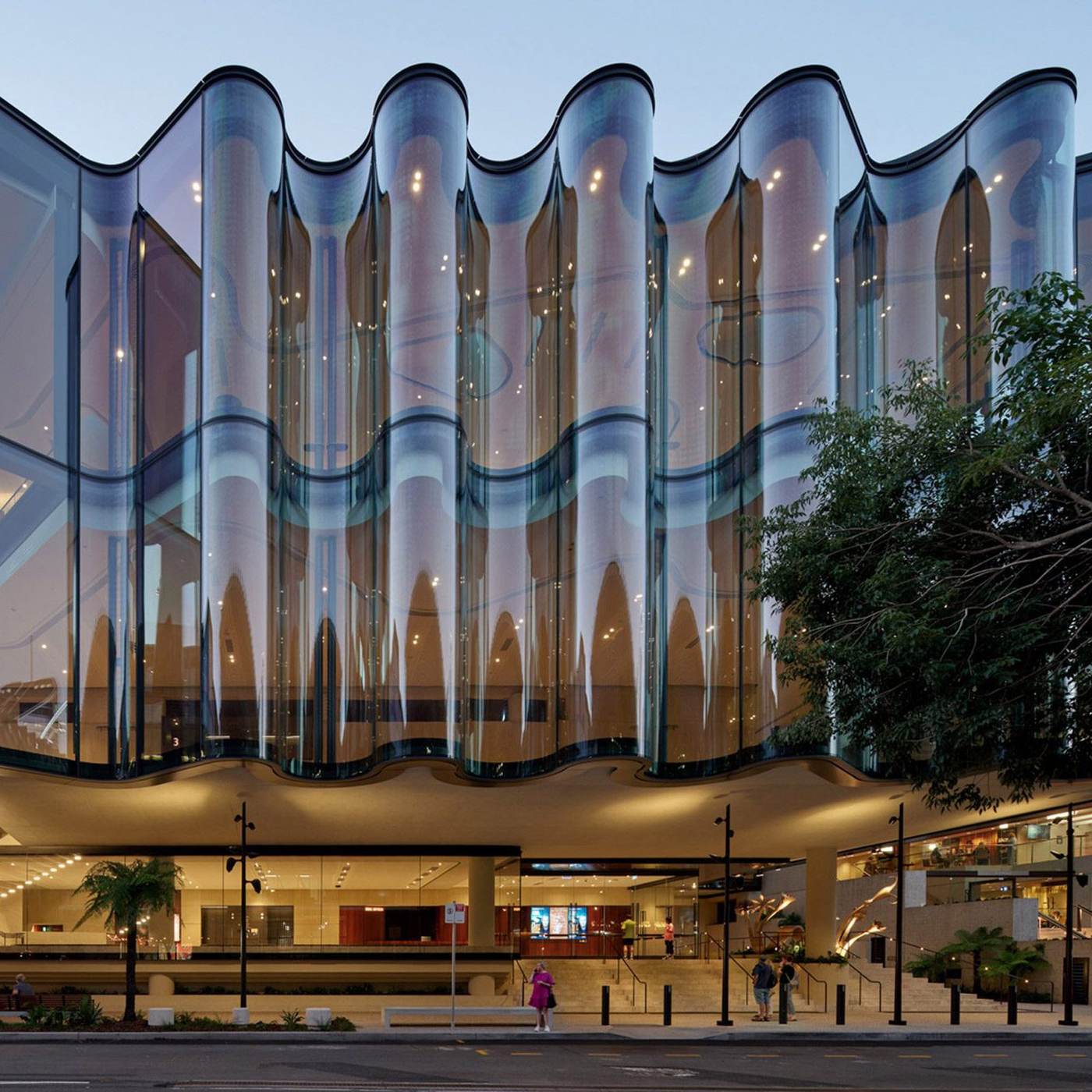 Undulating curved glass facade architecture — hot-bent glass application by ETERNAL