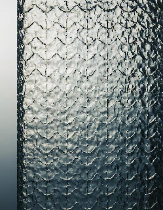 Dark toned embossed textured glass panel