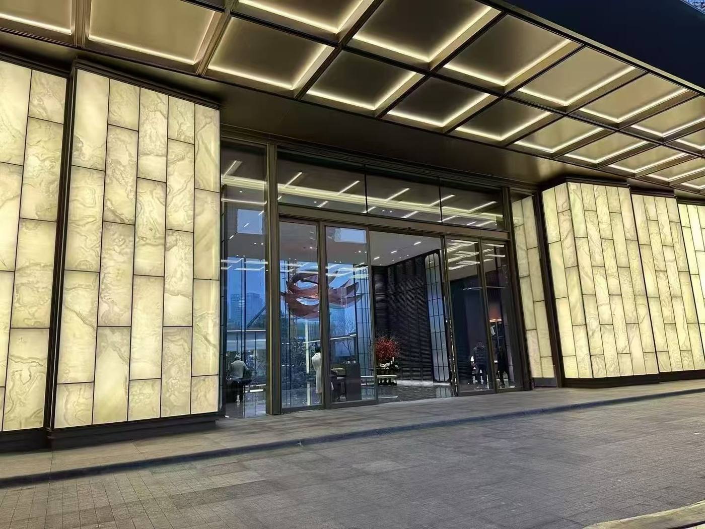 Faux alabaster panel facade at the hotel entrance — Luxury Hotel · Translucent Faux Alabaster Panel Lobby Project by ETERNAL