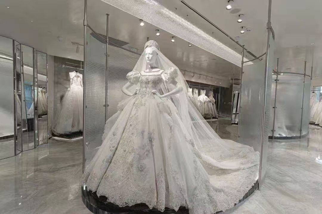 Wedding gown against textured glass — Bridal Boutique · Curved Textured Glass Project by ETERNAL