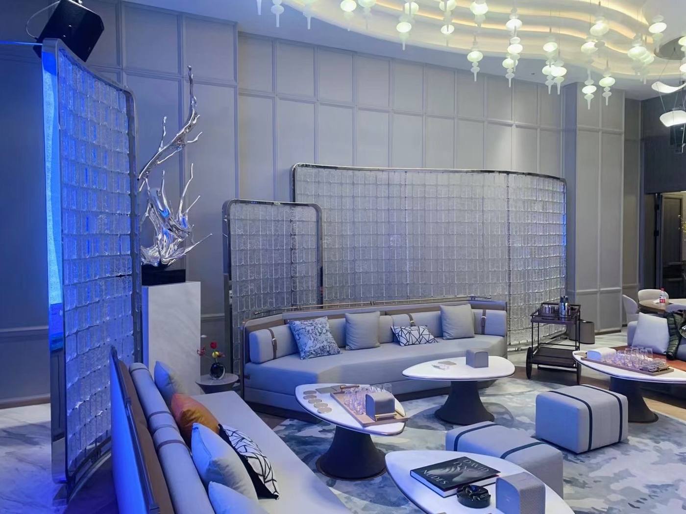 Crystal wall under blue ambient light — Clubhouse Lounge · Crystal Glass Tile Art Wall Project by ETERNAL